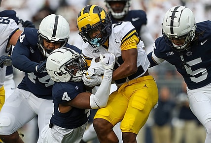 Nov 11, 2023; University Park, Pennsylvania, USA; Michigan Wolverines wide receiver Semaj Morgan (82) runs the ball against the Penn State Nittany Lions during the second quarter at Beaver Stadium. Mandatory Credit: Matthew O'Haren-USA TODAY Sports