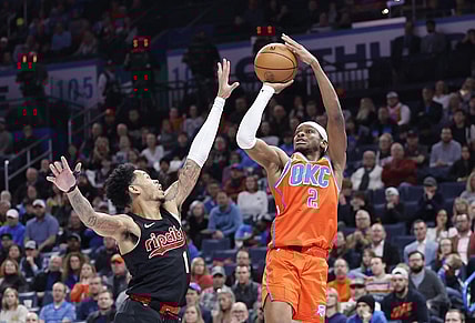 Jan 23, 2024; Oklahoma City, Oklahoma, USA; Oklahoma City Thunder guard Shai Gilgeous-Alexander (2) shoots as Portland Trail Blazers guard Anfernee Simons (1) defends during the second half at Paycom Center. Mandatory Credit: Alonzo Adams-USA TODAY Sports