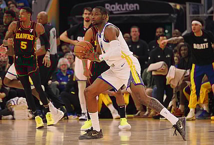 Jan 24, 2024; San Francisco, California, USA; Golden State Warriors forward Jonathan Kuminga (00) controls the ball against the Atlanta Hawks during the first quarter at Chase Center. Mandatory Credit: Kelley L Cox-USA TODAY Sports