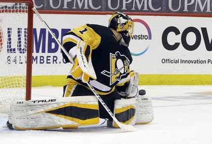 Mar 29, 2021; Pittsburgh, Pennsylvania, USA;  Pittsburgh Penguins goaltender Casey DeSmith (1) makes a save against the New York Islanders during the third period at PPG Paints Arena. Pittsburgh won 2-1 Mandatory Credit: Charles LeClaire-USA TODAY Sports