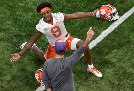 Clemson wide receiver Justyn Ross(8) stretches near head coach Dabo Swinney during Spring practice in Clemson Wednesday, February 26, 2020.

Clemson Football Spring Practice