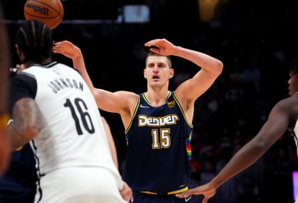 Feb 6, 2022; Denver, Colorado, USA; Denver Nuggets center Nikola Jokic (15) passes the ball in the second quarter against the Brooklyn Nets at Ball Arena. Mandatory Credit: Ron Chenoy-USA TODAY Sports