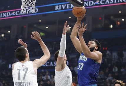 Mar 4, 2022; Oklahoma City, Oklahoma, USA; Minnesota Timberwolves center Karl-Anthony Towns (32) shoots as Oklahoma City Thunder forward Isaiah Roby (22) defends during the first quarter at Paycom Center. Mandatory Credit: Alonzo Adams-USA TODAY Sports