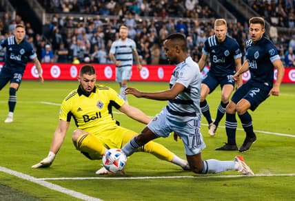 Nov 20, 2021; Kansas City, KS, USA; Sporting Kansas City midfielder Gadi Kinda (17) and Vancouver Whitecaps goalkeeper Maxime Crepeau (16) during the second half at Children's Mercy Park. Mandatory Credit: Jay Biggerstaff-USA TODAY Sports