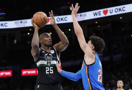 Mar 8, 2022; Oklahoma City, Oklahoma, USA; Milwaukee Bucks center Serge Ibaka (25) shoots as Oklahoma City Thunder forward Isaiah Roby (22) defends the shot during the second half at Paycom Center. Milwaukee won 142-115. Mandatory Credit: Alonzo Adams-USA TODAY Sports