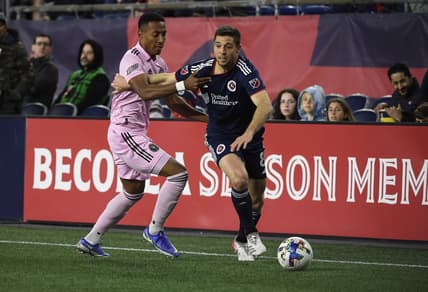 Apr 30, 2022; Foxborough, Massachusetts, USA; Inter Miami defender Jairo Quinteros (15) grabs New England Revolution midfielder Matt Polster (8) during the first half at Gillette Stadium. Mandatory Credit: Bob DeChiara-USA TODAY Sports