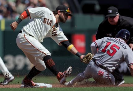 Sep 14, 2022; San Francisco, California, USA; Atlanta Braves left fielder Robbie Grossman (15) is tagged out at second base by San Francisco Giants shortstop Brandon Crawford (35) during the third inning at Oracle Park. Mandatory Credit: Sergio Estrada-USA TODAY Sports