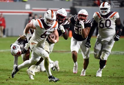 Oct 27, 2022; Raleigh, North Carolina, USA; Virginia Tech Hokies quarterback Grant Wells (6) runs for a touchdown during the second half against the North Carolina State Wolfpack at Carter-Finley Stadium.  The Wolfpack won 22-21. Mandatory Credit: Rob Kinnan-USA TODAY Sports