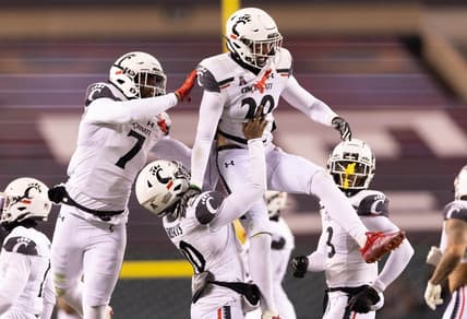 Nov 19, 2022; Philadelphia, Pennsylvania, USA; Cincinnati Bearcats safety Jacob Dingle (29) celebrates with teammates after intercepting a pass against the Temple Owls during the second quarter at Lincoln Financial Field. Mandatory Credit: Bill Streicher-USA TODAY Sports