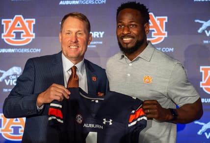 Auburn Tigers football coach Hugh Freeze poses with associate head coach Cadillac Williams at the Woltosz Football Performance Center in Auburn, Ala., on Tuesday, Nov. 29, 2022