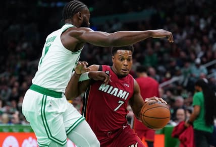 Nov 30, 2022; Boston, Massachusetts, USA; Miami Heat guard Kyle Lowry (7) drives the ball against Boston Celtics guard Jaylen Brown (7) in the first quarter at TD Garden. Mandatory Credit: David Butler II-USA TODAY Sports