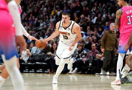 Dec 14, 2022; Denver, Colorado, USA; Denver Nuggets center Nikola Jokic (15) controls the ball in the second half against the Washington Wizards at Ball Arena. Mandatory Credit: Ron Chenoy-USA TODAY Sports