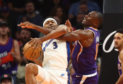 Dec 20, 2022; Phoenix, Arizona, USA; Washington Wizards guard Bradley Beal (3) is fouled by Phoenix Suns center Bismack Biyombo in the second half at Footprint Center. Mandatory Credit: Mark J. Rebilas-USA TODAY Sports