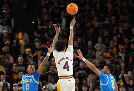 Jan 19, 2023; Tempe, Arizona, USA; Arizona State Sun Devils guard Desmond Cambridge Jr. (4) shoots over UCLA Bruins guard Dylan Andrews (2) and UCLA Bruins guard Jaylen Clark (0) during the first half at Desert Financial Arena. Mandatory Credit: Joe Camporeale-USA TODAY Sports