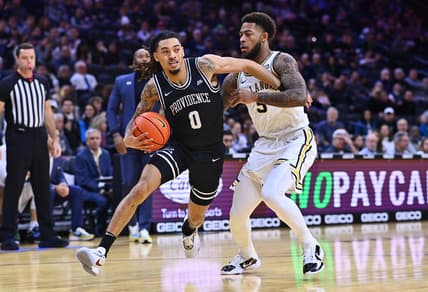 Jan 29, 2023; Philadelphia, Pennsylvania, USA; Providence Friars guard Alyn Breed (0) drives against Villanova Wildcats guard Justin Moore (5) in the first half at Wells Fargo Center. Mandatory Credit: Kyle Ross-USA TODAY Sports