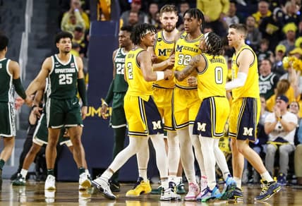 Michigan players celebrate a play against Michigan State made by forward Tarris Reed Jr. (32) during the second half at Crisler Center in Ann Arbor on Saturday, Feb. 18, 2023.