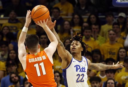 Feb 25, 2023; Pittsburgh, Pennsylvania, USA; Syracuse Orange guard Joseph Girard III (11) shoots against Pittsburgh Panthers guard Nike Sibande (22) during the first half at the Petersen Events Center. Mandatory Credit: Charles LeClaire-USA TODAY Sports