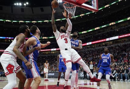 Mar 22, 2023; Chicago, Illinois, USA; Philadelphia 76ers center Joel Embiid (21) defends Chicago Bulls center Andre Drummond (3) during the first quarter at United Center. Mandatory Credit: David Banks-USA TODAY Sports