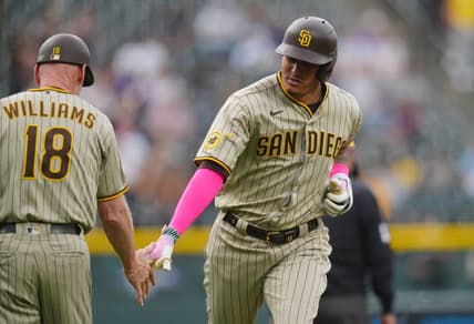 Jun 9, 2023; Denver, Colorado, USA; San Diego Padres third baseman Manny Machado (13) celebrates his two-run home run with San Diego Padres third base coach Matt Williams (18) in the first inning against the Colorado Rockies at Coors Field. Mandatory Credit: Ron Chenoy-USA TODAY Sports