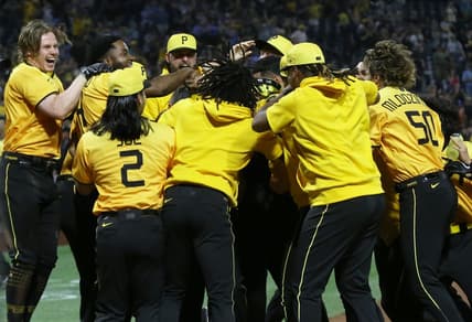 Jun 30, 2023; Pittsburgh, Pennsylvania, USA; The Pittsburgh Pirates celebrate a walk-off two-run home run by first baseman Carlos Santana (hidden) to defeat the Milwaukee Brewers at PNC Park. Mandatory Credit: Charles LeClaire-USA TODAY Sports