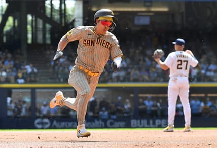 Aug 27, 2023; Milwaukee, Wisconsin, USA; San Diego Padres second baseman Ha-Seong Kim (7) runs from first to third base against the Milwaukee Brewers in the first inning at American Family Field. Mandatory Credit: Michael McLoone-USA TODAY Sports