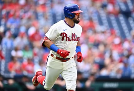 Sep 10, 2023; Philadelphia, Pennsylvania, USA; Philadelphia Phillies outfielder Kyle Schwarber (12) advances to first after hitting a single against the Miami Marlins in the first inning at Citizens Bank Park. Mandatory Credit: Kyle Ross-USA TODAY Sports