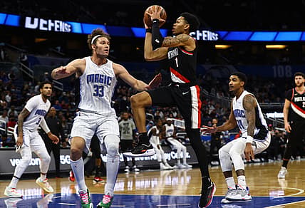 Jan 17, 2022; Orlando, Florida, USA; Portland Trail Blazers guard Anfernee Simons (1) shoots over Orlando Magic center Robin Lopez (33) during the first quarter at Amway Center. Mandatory Credit: Kim Klement-USA TODAY Sports