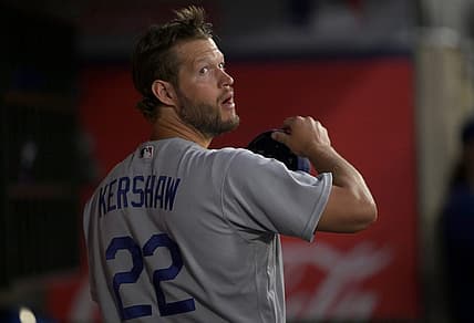 Jul 15, 2022; Anaheim, California, USA;  Los Angeles Dodgers starting pitcher Clayton Kershaw (22) waits in the dugout during the fifth inning against the Los Angeles Angels at Angel Stadium. Mandatory Credit: Jayne Kamin-Oncea-USA TODAY Sports