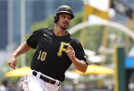 Aug 4, 2022; Pittsburgh, Pennsylvania, USA;  Pittsburgh Pirates center fielder Bryan Reynolds (10) runs from first base to third base against the Milwaukee Brewers during the first inning at PNC Park. Mandatory Credit: Charles LeClaire-USA TODAY Sports