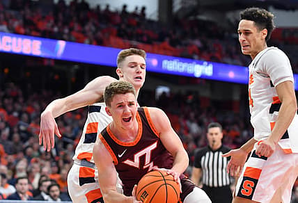 Jan 11, 2023; Syracuse, New York, USA; Virginia Tech Hokies guard Sean Pedulla (3) reacts to a foul by Syracuse Orange guard Justin Taylor (behind) in the first half at JMA Wireless Dome. Mandatory Credit: Mark Konezny-USA TODAY Sports