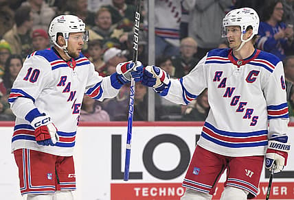 Nov 4, 2023; Saint Paul, Minnesota, USA; New York Rangers forward Artemi Panarin (10) celebrates his goal against the Minnesota Wild with defenseman Jacob Trouba (8) during the first period at Xcel Energy Center. Mandatory Credit: Nick Wosika-USA TODAY Sports