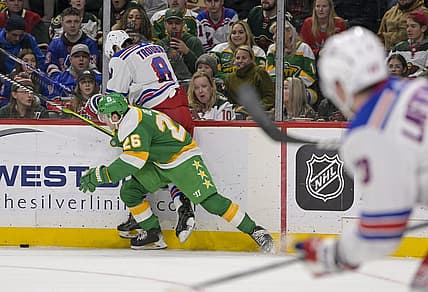 Nov 4, 2023; Saint Paul, Minnesota, USA; Minnesota Wild forward Connor Dewar (26) bumps New York Rangers defenseman Jacob Trouba (8) off of the puck during the second period at Xcel Energy Center. Mandatory Credit: Nick Wosika-USA TODAY Sports