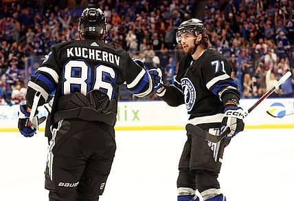 Feb 15, 2024; Tampa, Florida, USA; Tampa Bay Lightning right wing Nikita Kucherov (86) is Colorado Avalanche by Tampa Bay Lightning center Anthony Cirelli (71) after he scored a goal against the Colorado Avalanche during the first period at Amalie Arena. Mandatory Credit: Kim Klement Neitzel-USA TODAY Sports