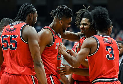 Feb 28, 2024; Indianapolis, Indiana, USA; St. John's Red Storm forward Zuby Ejiofor (24) and St. John's Red Storm forward Glenn Taylor Jr. (35) celebrate during a timeout against the Butler Bulldogs during the first half at Hinkle Fieldhouse. Mandatory Credit: Robert Goddin-USA TODAY Sports