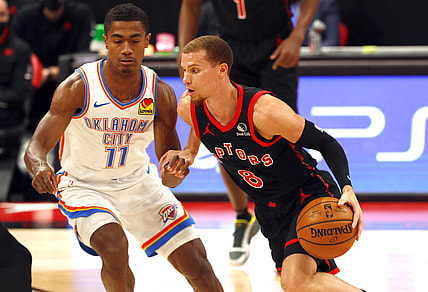 Apr 18, 2021; Tampa, Florida, USA; Toronto Raptors guard Malachi Flynn (8) drives to the basket as Oklahoma City Thunder guard Theo Maledon (11) defends during the first half at Amalie Arena. Mandatory Credit: Kim Klement-USA TODAY Sports