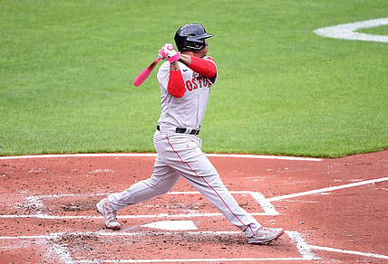 May 9, 2021; Baltimore, Maryland, USA; Boston Red Sox third baseman Rafael Devers (11) hits a home run during the second inning against the Baltimore Orioles at Oriole Park at Camden Yards. Mandatory Credit: Evan Habeeb-USA TODAY Sports