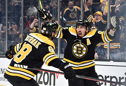 May 21, 2021; Boston, Massachusetts, USA; Boston Bruins center Brad Marchand (63) reacts on a goal by right wing David Pastrnak (88) during the second period in game four of the first round of the 2021 Stanley Cup Playoffs against the Washington Capitals at TD Garden. Mandatory Credit: Bob DeChiara-USA TODAY Sports