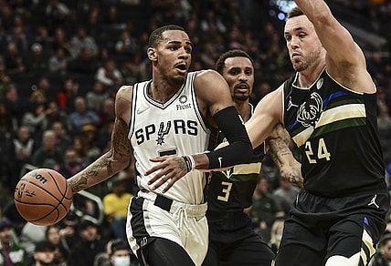 Oct 30, 2021; Milwaukee, Wisconsin, USA; San Antonio Spurs guard Dejounte Murray (5) drives to the basket against Milwaukee Bucks guard Pat Connaughton (24) in the first quarter at Fiserv Forum. Mandatory Credit: Benny Sieu-USA TODAY Sports