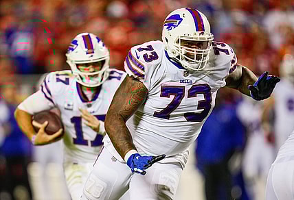 Oct 10, 2021; Kansas City, Missouri, USA; Buffalo Bills offensive tackle Dion Dawkins (73) gets ready to block for quarterback Josh Allen (17) during the first half against the Kansas City Chiefs at GEHA Field at Arrowhead Stadium. Mandatory Credit: Jay Biggerstaff-USA TODAY Sports