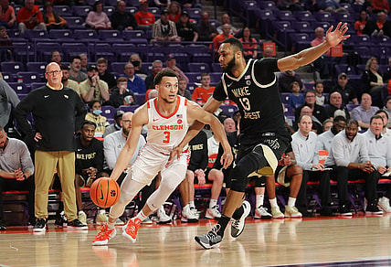 Feb 23, 2022; Clemson, South Carolina, USA; Clemson Tigers guard Chase Hunter (3) drives to the basket as Wake Forest Demon Deacons forward Dallas Walton (13) defends during the first half at Littlejohn Coliseum. Mandatory Credit: Dawson Powers-USA TODAY Sports