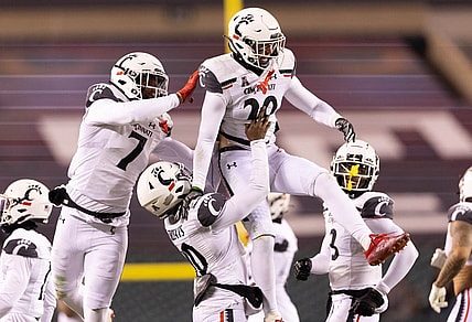 Nov 19, 2022; Philadelphia, Pennsylvania, USA; Cincinnati Bearcats safety Jacob Dingle (29) celebrates with teammates after intercepting a pass against the Temple Owls during the second quarter at Lincoln Financial Field. Mandatory Credit: Bill Streicher-USA TODAY Sports