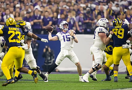 Dec 31, 2022; Glendale, Arizona, USA; TCU Horned Frogs quarterback Max Duggan (15) against the Michigan Wolverines during the 2022 Fiesta Bowl at State Farm Stadium. Mandatory Credit: Mark J. Rebilas-USA TODAY Sports