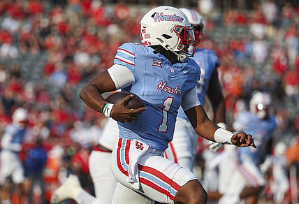Sep 2, 2023; Houston, Texas, USA; Houston Cougars quarterback Donovan Smith (1) runs with the ball during the first quarter against the UTSA Roadrunners at TDECU Stadium. Mandatory Credit: Troy Taormina-USA TODAY Sports