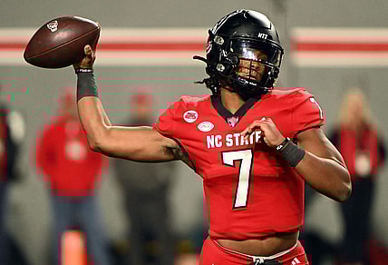Nov 4, 2023; Raleigh, North Carolina, USA; North Carolina State Wolfpack quarterback MJ Morris (7) throws a pass during the first half against the Miami Hurricanes at Carter-Finley Stadium. Mandatory Credit: Rob Kinnan-USA TODAY Sports