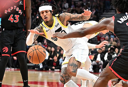 Dec 23, 2023; Toronto, Ontario, CAN;  Utah Jazz guard Jordan Clarkson (00) pursues a loose ball against the Toronto Raptors in the second half at Scotiabank Arena. Mandatory Credit: Dan Hamilton-USA TODAY Sports