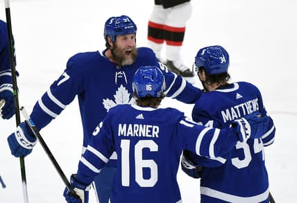 Feb 18, 2021; Toronto, Ontario, CAN;  Toronto Maple Leafs forward Auston Matthews (34) celebrates scoring against Ottawa Senators with forwards Mitchell Marner (16) and Joe Thornton (97) in the first period at Scotiabank Arena. Mandatory Credit: Dan Hamilton-USA TODAY Sports