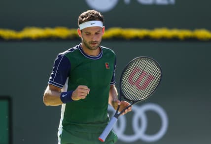 Grigor Dimitrov of Bulgaria celebrates a point against Daniil Medvedev of Russia during their round four match of the BNP Paribas Open, Wednesday, Oct. 13, 2021, in Indian Wells, Calif.