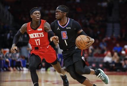 Mar 1, 2022; Houston, Texas, USA; Los Angeles Clippers guard Reggie Jackson (1) drives with the ball as Houston Rockets guard Dennis Schroder (17) defends during the first quarter at Toyota Center. Mandatory Credit: Troy Taormina-USA TODAY Sports