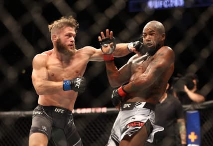 Aug 7, 2021; Houston, Texas, USA; Bobby Green (red gloves) fights Rafael Fiziev (blue gloves) during UFC 265 at Toyota Center. Mandatory Credit: Troy Taormina-USA TODAY Sports