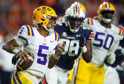 LSU Tigers quarterback Jayden Daniels (5) eludes Auburn Tigers defensive end Marcus Bragg (98) as the Auburn Tigers take on the LSU Tigers at Jordan-Hare Stadium in Auburn, Ala., on Saturday, Oct. 1, 2022.

Aulsu17